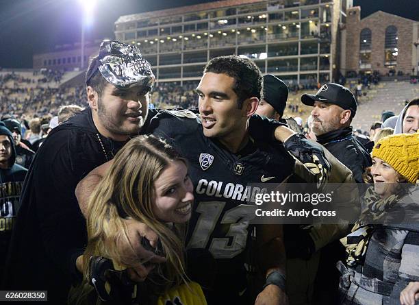 November 26: Colorado Buffaloes quarterback Sefo Liufau celebrates his victory over the Utah Utes with his brother Saia Liufau and friend Lauren...