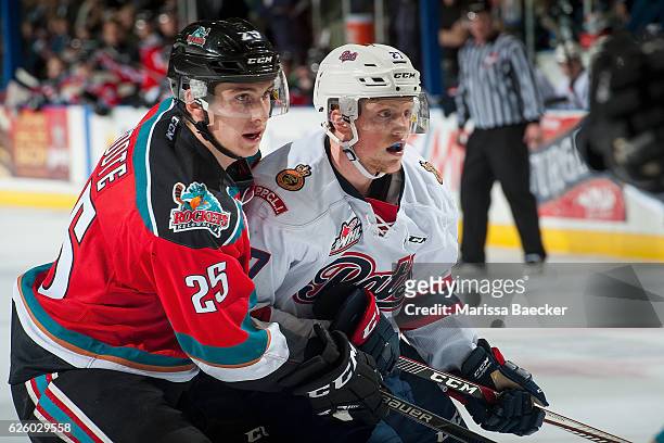 Cal Foote of the Kelowna Rockets checks Austin Wagner of the Regina Pats during second period on November 26, 2016 at Prospera Place in Kelowna,...