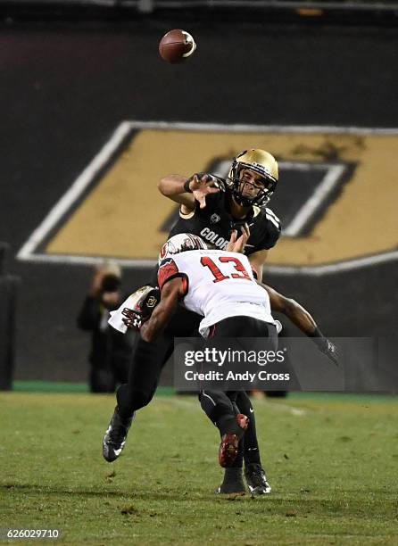 November 26: Colorado Buffaloes quarterback Sefo Liufau throws under pressure from Utah Utes defensive back Jordan Fogal in the third quarter at...