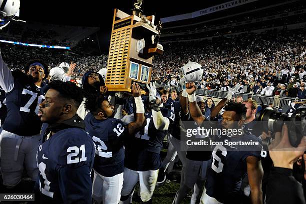 Penn State's Sterling Jenkins , Amani Oruwariye , Paris Palmer , Jordan Smith , Brandon Bell , Ayron Monroe , and Malik Golden celebrate with the...