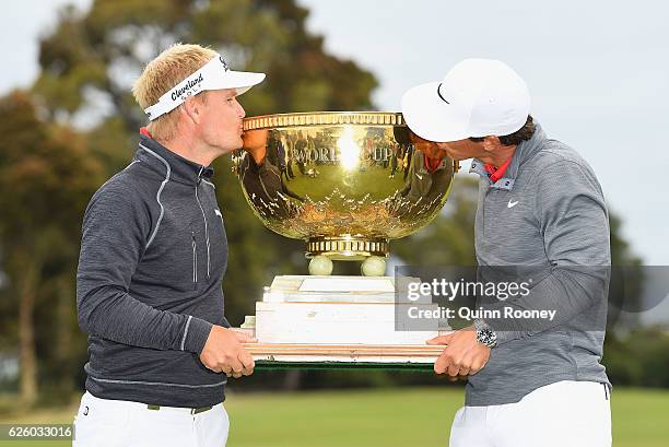 Soren Kjeldsen and Thorbjorn Olesen of Denmark pose with the trophy after winning the tournament during day four of the World Cup of Golf at Kingston...