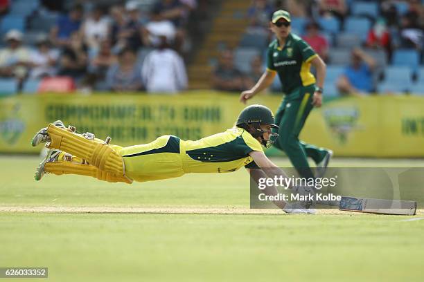 Alex Blackwell of Australia dives to make her ground as she bats during the women's One Day International match between the Australian Southern Stars...