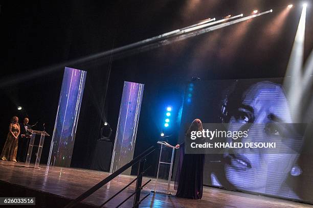 Picture taken on November 26 shows a screen displaying the portrait of Egypt's late veteran actress Faten Hamama, to honor her and her career during...