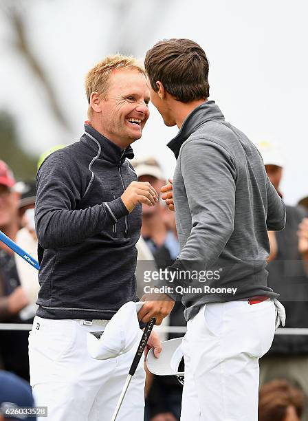 Soren Kjeldsen and Thorbjorn Olesen of Denmark celebrate winning the tournament during day four of the World Cup of Golf at Kingston Heath Golf Club...