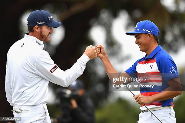 Jimmy Walker and Rickie Fowler of the USA celebrate a birdie during day four of the World Cup of Golf at Kingston Heath Golf Club on November 27,...