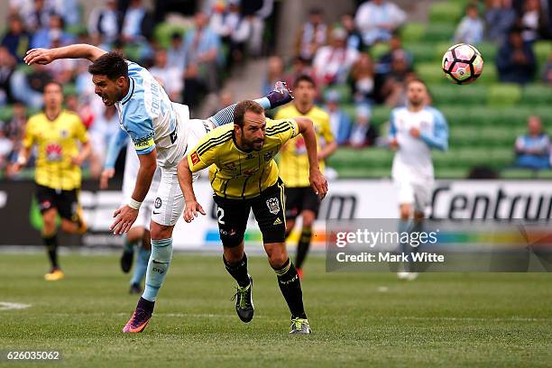 Bruno Fornaroli of Melbourne City goes flying over Adam Parkhouse of Wellington Phoenix during the round eight A-League match between Melbourne City...