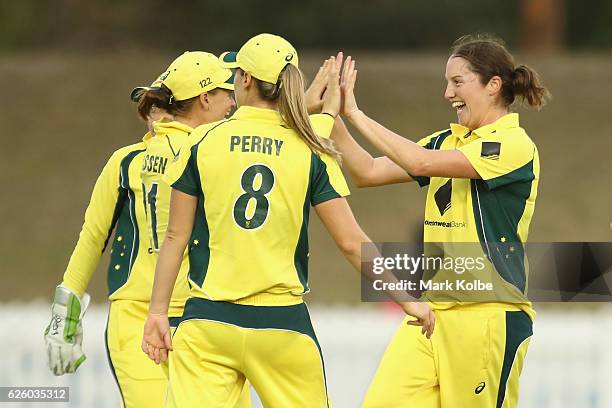 Rene Farrell of Australia celebrates with her team mates after taking the wicket of Sune Luus of South Africa during the women's One Day...