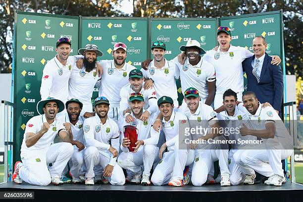 Faf du Plessis of South Africa and the South African team celebrate after winning the series 2-1 during day four of the Third Test match between...