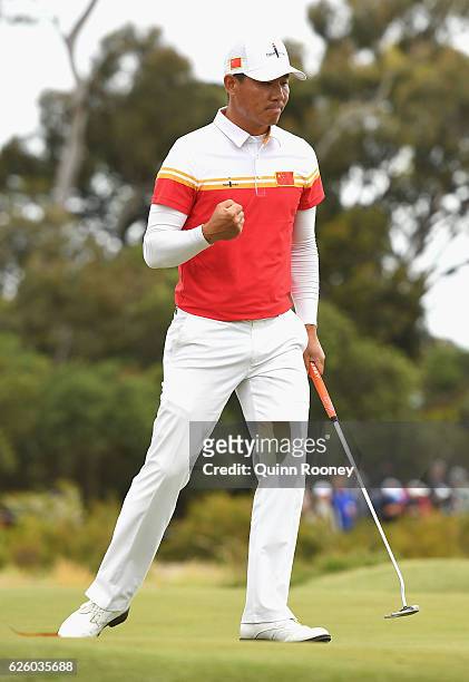 Ashun Wu of China celebrates a birdie during day four of the World Cup of Golf at Kingston Heath Golf Club on November 27, 2016 in Melbourne,...