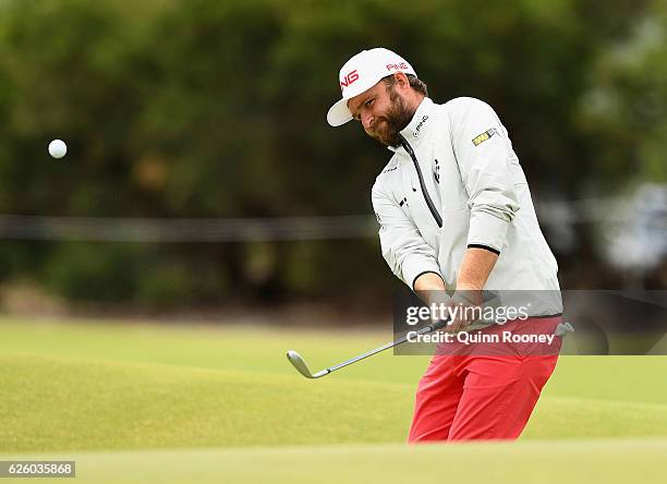 Andy Sullivan of England chips during day four of the World Cup of Golf at Kingston Heath Golf Club on November 27, 2016 in Melbourne, Australia.