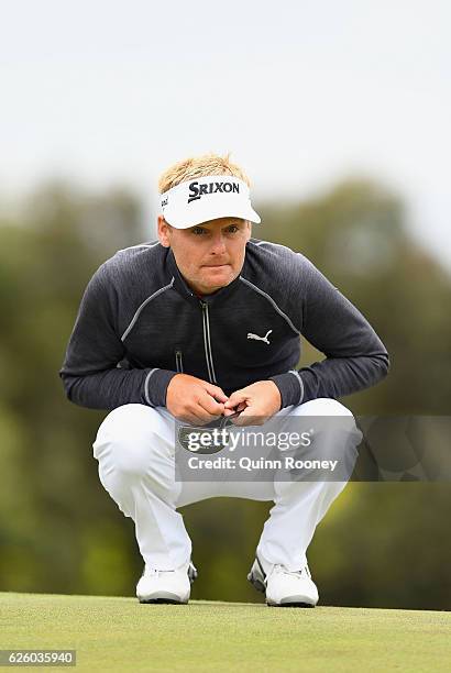 Soren Kjeldsen of Denmark lines up a putt during day four of the World Cup of Golf at Kingston Heath Golf Club on November 27, 2016 in Melbourne,...