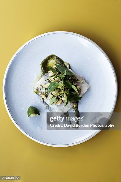 salt-baked barramundi fillet - barramundi stock pictures, royalty-free photos & images