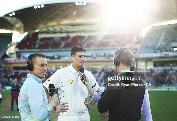 Matt Renshaw of Australia is interviewed by former Australian Opening Bastman Chris Rogers after day four of the Third Test match between Australia...