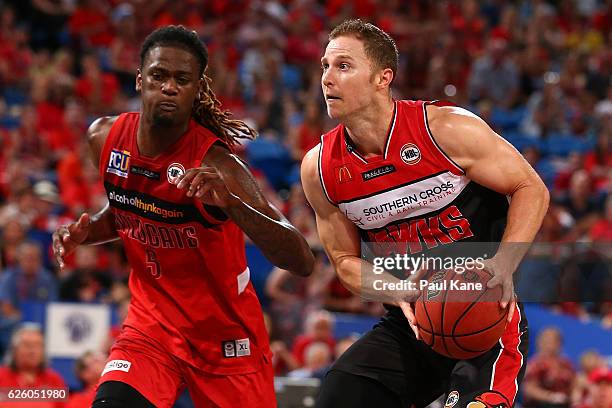 Tim Coenraad of the Hawks controls the ball against Jameel McKay of the Wildcats during the round eight NBL match between the Perth Wildcats and the...