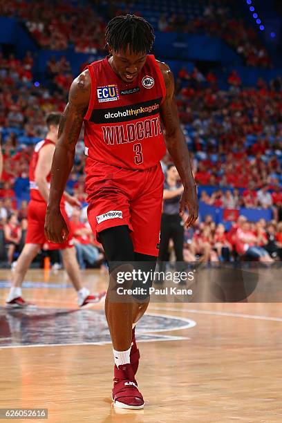 Jaron Johnson of the Wildcats limps from the court with a suspected knww injury during the round eight NBL match between the Perth Wildcats and the...