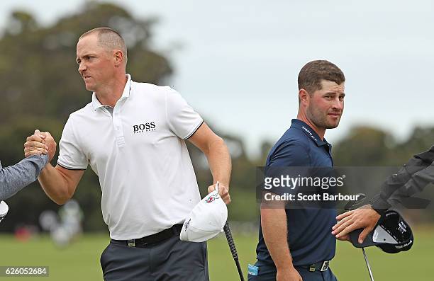 Alex Noren and David Lingmerth of Sweden celebrate on the 18th hole during day four of the World Cup of Golf at Kingston Heath Golf Club on November...