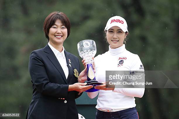 The chairman of LPGA Japan Hiromi kobayashi and Ha-Neul Kim of South Korea poses with Championship's trophy during a ceremony following the LPGA Tour...