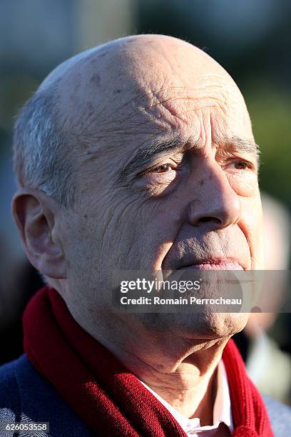 Alain Juppe, Mayor of Bordeaux and Les Republicains presidential candidate hopeful looks on after his votes during the second round of voting in the...