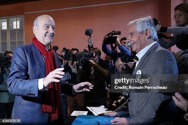 Alain Juppe, Mayor of Bordeaux and Les Republicains presidential candidate hopeful votes during the second round of voting in the Republican Party's...