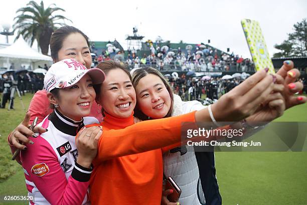 Megumi Kido of Japan takes a selfie with Bo-Mee Lee. Sun-Ju Ahn and Soo-Yun Kang of South Korea during a ceremony following the LPGA Tour...