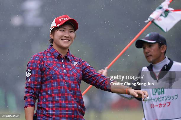 Misuzu Narita of Japan reacts after a putt on the 18th green during the final round of the LPGA Tour Championship Ricoh Cup 2016 at the Miyazaki...