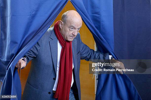 Alain Juppe, Mayor of Bordeaux and Les Republicains presidential candidate hopeful votes during the second round of voting in the Republican Party's...