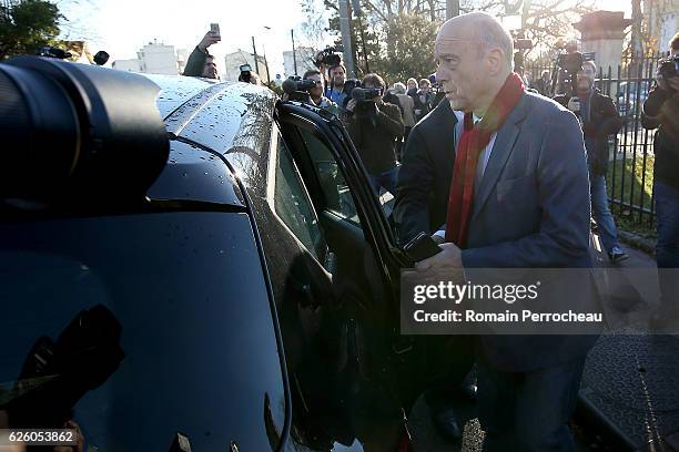 Alain Juppe, Mayor of Bordeaux and Les Republicains presidential candidate hopeful looks on after his votes during the second round of voting in the...