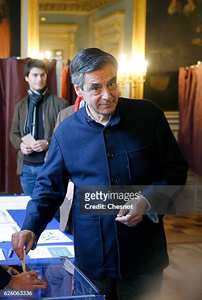 Former French Prime Minister and presidential candidate hopeful Francois Fillon votes during the second round of voting in the Republican Party's...