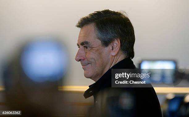 Former French Prime Minister and presidential candidate hopeful Francois Fillon arrives to vote during the second round of voting in the Republican...