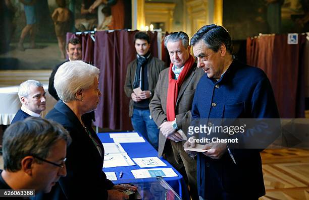 Former French Prime Minister and presidential candidate hopeful Francois Fillon votes during the second round of voting in the Republican Party's...
