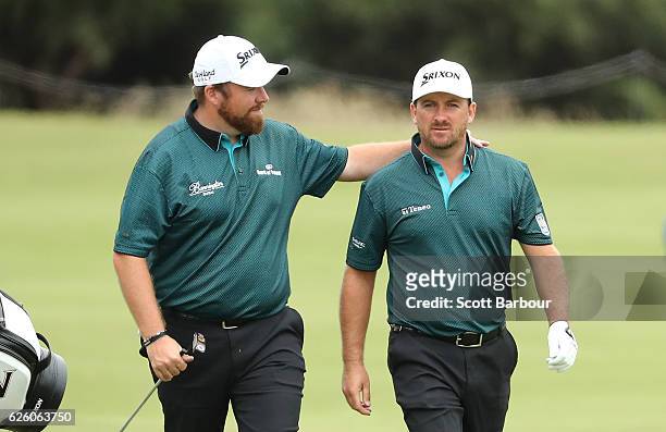 Shane Lowry and Graeme McDowell walk up to the 18th hole during day four of the World Cup of Golf at Kingston Heath Golf Club on November 27, 2016 in...