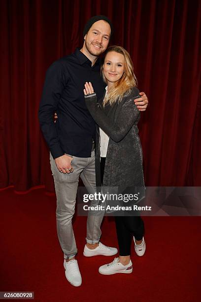 Anna Hofbauer and partner Marvin Albrecht attend the European premiere of 'Sing' at Cinedom on November 27, 2016 in Cologne, Germany.