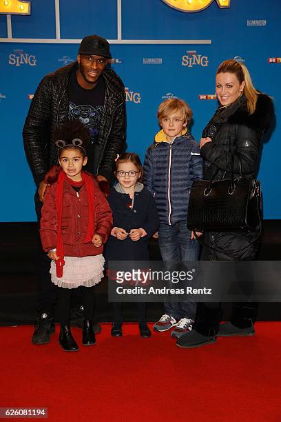 Anthony Modeste with his wife and kids attend the European premiere of 'Sing' at Cinedom on November 27, 2016 in Cologne, Germany.