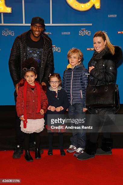 Anthony Modeste with his wife and kids attend the European premiere of 'Sing' at Cinedom on November 27, 2016 in Cologne, Germany.