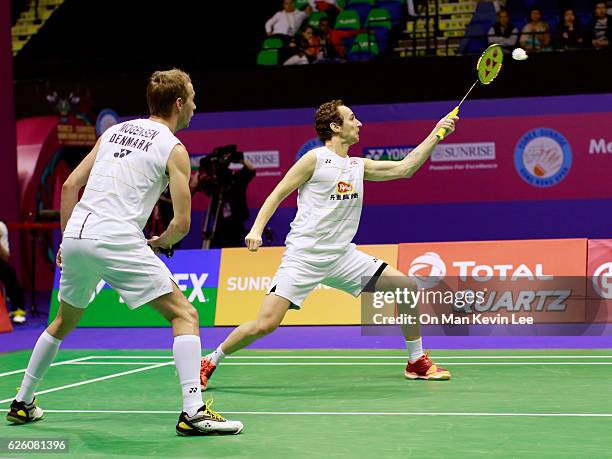 Mathias Boe and Carsten Mogensen of Denmark in action against Takeshi Kamura and Keigo Sonoda of Japan during the Men's Doubles Final on day 6 of the...