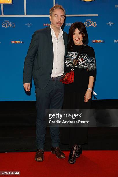 Olli Schulz and Iris Berben attend the European premiere of 'Sing' at Cinedom on November 27, 2016 in Cologne, Germany.