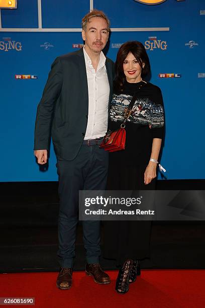 Olli Schulz and Iris Berben attend the European premiere of 'Sing' at Cinedom on November 27, 2016 in Cologne, Germany.