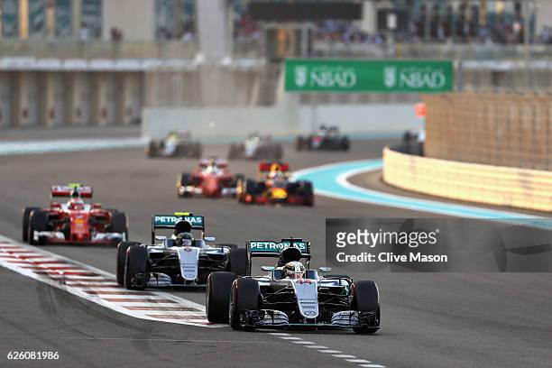Lewis Hamilton of Great Britain driving the Mercedes AMG Petronas F1 Team Mercedes F1 WO7 Mercedes PU106C Hybrid turbo leads Nico Rosberg of Germany...