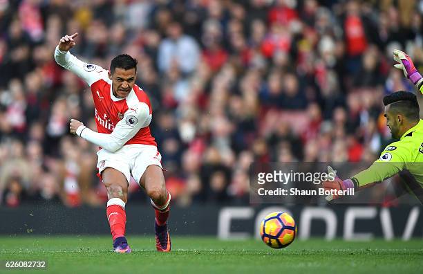 Alexis Sanchez of Arsenal scores his sides first goal during the Premier League match between Arsenal and AFC Bournemouth at Emirates Stadium on...