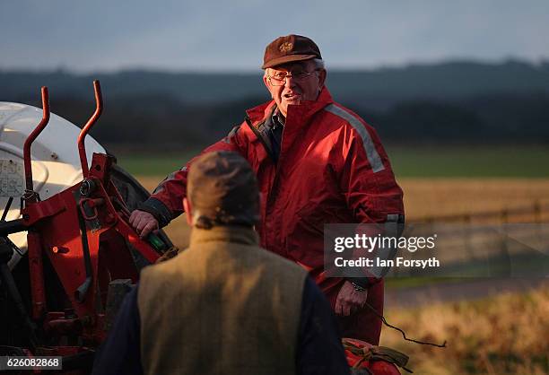 James Jobson from Hartlepool chats to a fellow competitor during the annual ploughing match on November 27, 2016 in Staithes, United Kingdom. The...