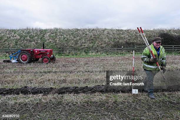 Gordon Sumley from Scarborough walks out to place his rig sticks to help him keep his ploughing straight during the annual ploughing match on...