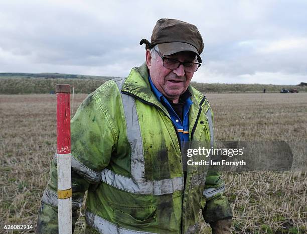 Gordon Sumley from Scarborough places his rig sticks into the ground to help him keep his ploughing straight during the annual ploughing match on...