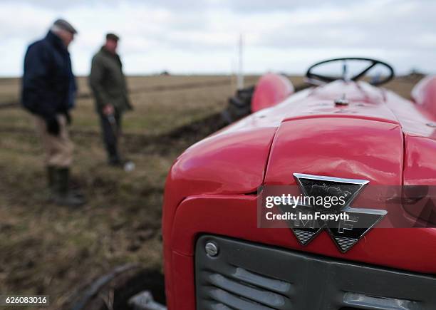 Two men inspect the furrows during the annual ploughing match on November 27, 2016 in Staithes, United Kingdom. The event which is held each year in...