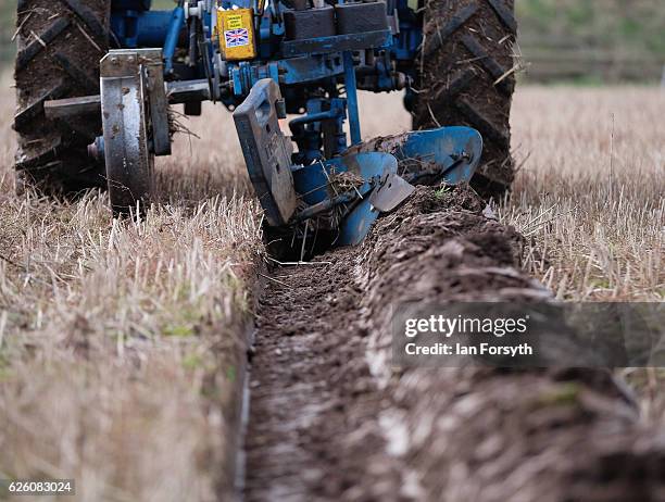 Competitor ploughs a furrow as he takes part in the annual ploughing match on November 27, 2016 in Staithes, United Kingdom. The event which is held...