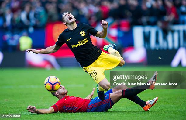 Lucas Hernandez of Atletico Madrid duels for the ball with Cayetano Bonnin 'tano' of CA Osasuna during the La Liga match between CA Osasuna and...