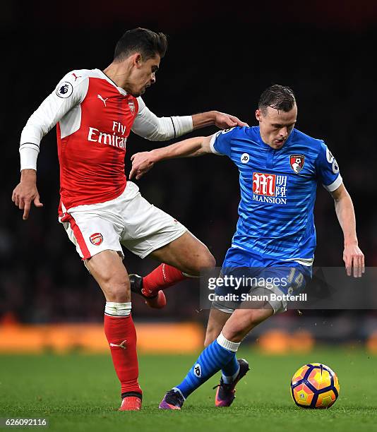 Gabriel of Arsenal attempts to tackle Brad Smith of AFC Bournemouth during the Premier League match between Arsenal and AFC Bournemouth at Emirates...