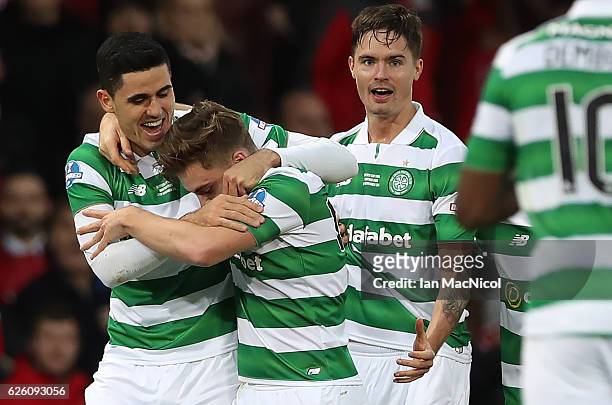Tom Rogic of Celtic hugs James Forrest of Celtic after he scores his teams second goal during the Betfred Cup Final between Aberdeen and Celtic at...