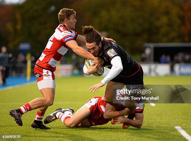Mike Ellery of Saracens is tackled by Callum Braley and Ollie Thorley of Gloucester Rugby during the Aviva Premiership match between Saracens and...