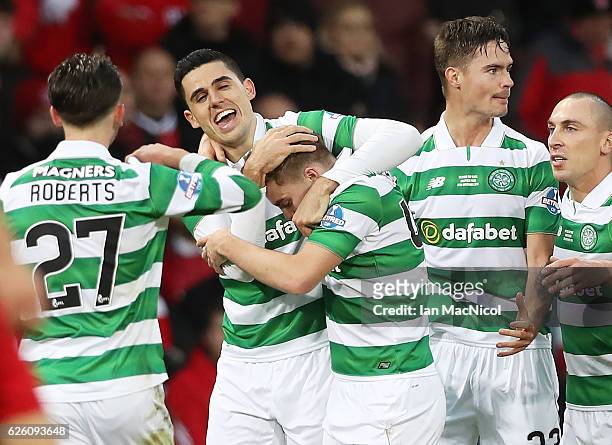 Tom Rogic of Celtic hugs James Forrest of Celtic after he scores his teams second goal during the Betfred Cup Final between Aberdeen and Celtic at...