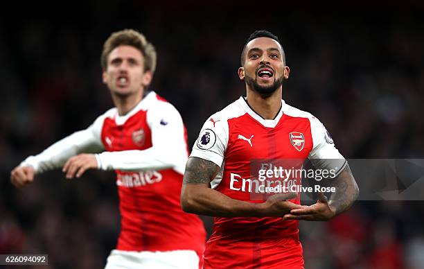 Theo Walcott of Arsenal celebrates scoring his sides second goal during the Premier League match between Arsenal and AFC Bournemouth at Emirates...